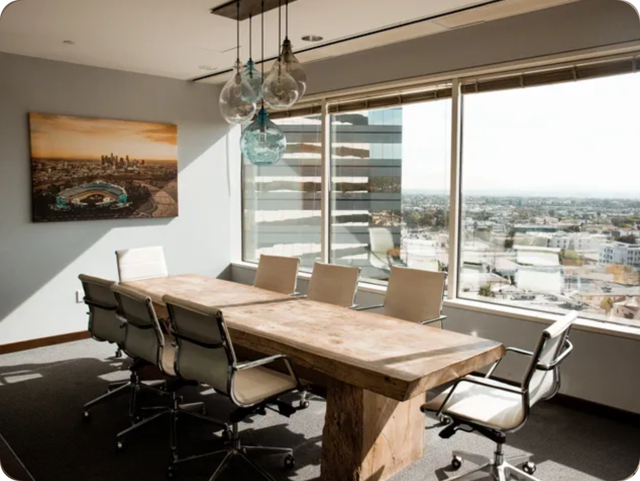 4444 A conference room with a large table and chairs.