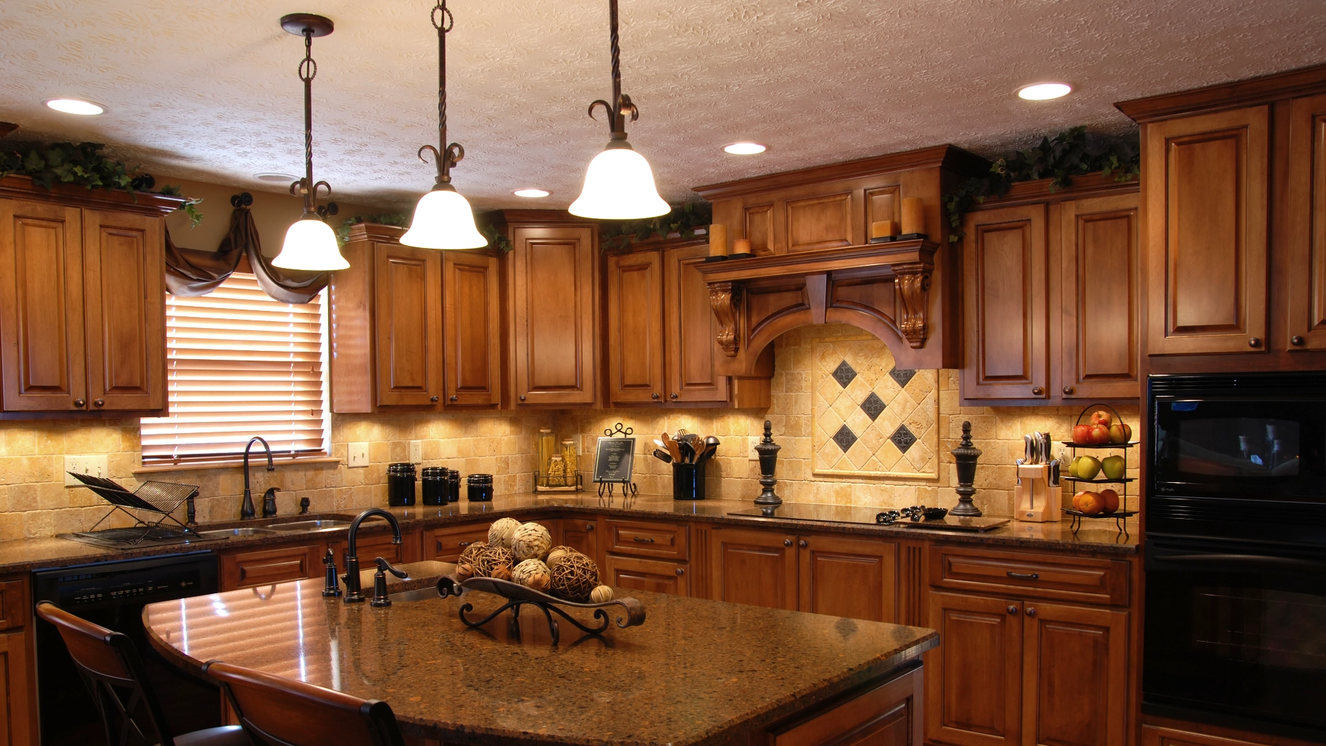 Rustic kitchen with wooden cabinets and lighting.